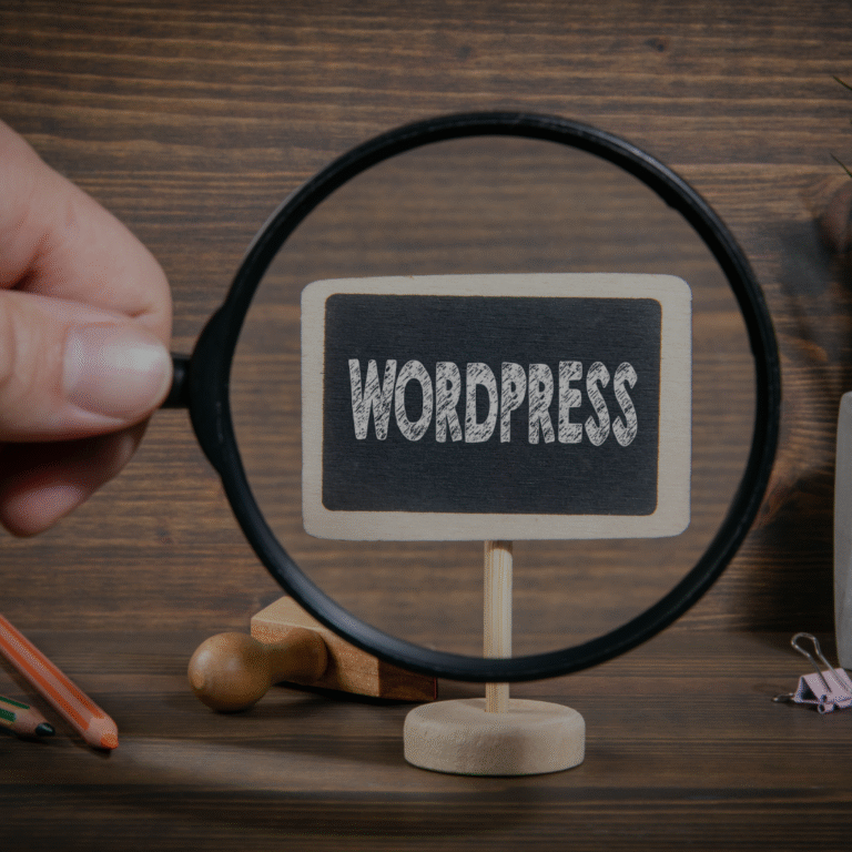 Magnifying glass focusing on the WordPress logo, symbolizing analysis and comparison of website platforms.